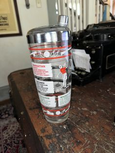 a glass sitting on top of a wooden table