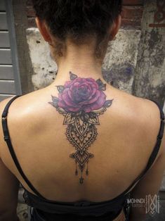 a woman with a tattoo on her back