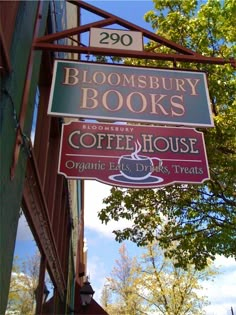 a sign hanging from the side of a building that reads bloomsbury books coffee house