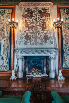 an ornate fireplace in the middle of a room