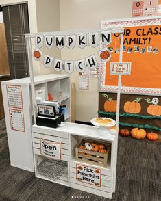 a classroom display with pumpkins and other decorations