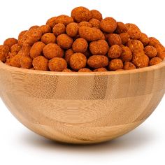 a wooden bowl filled with meatballs on a white background