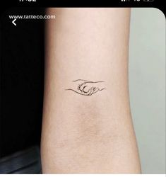 a woman's arm with a small tattoo on the left side of her leg