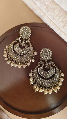 Mirror chandbali earrings/ Kundan earrings /Statement earrings / Bridal earrings/Pearl drop earrings/CZ Jhumka /Bridesmaid Earrings Making Time 10-15 Days Style: Victorian In Personal trust me this is so much beautiful and in great quality, video call also available too see our products. Stunning Sonam Kapoor inspired Jadau Kundan Jhumka statement earrings with green onyx Pearls chains and drops. Perfect to make a statement at weddings. Earrings come with attached sahare (kaanchain) for support High quality and craftsmanship. Closure: Pushback Highest quality and craftsmanship   Women love jewellery; specially artificial jewellery adore a women, They wear it on different occasion, They have special importance on ring ceremony, wedding and festive time, They can also wear it on regular basi Luxury Traditional Bridal Earrings With Latkans, Bollywood Pearl Chandbali Earrings With Pearl Drop, Traditional Pearl Drop Hoop Earrings For Wedding, Elegant Kundan Chandbalis For Pierced Ears, Pearl Drop Chandbalis For Diwali Reception, Elegant Kundan Chandbalis, Pearl Drop Chandbalis For Reception And Diwali, Bollywood Pearl Drop Chandelier Earrings For Receptions, Kundan Chandbalis With Pearl Drop For Reception