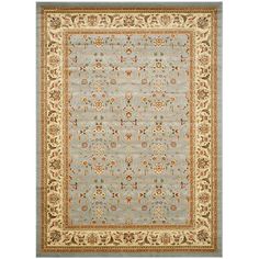 a light blue and beige rug with an ornate design on the bottom, in front of a