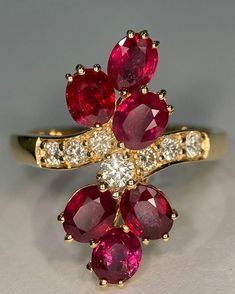 Luxury Ruby Flower Ring In Fine Jewelry Style, Exquisite Yellow Gold Ruby Ring For Formal Occasions, Exquisite Yellow Gold Ruby Ring For Formal Events, Exquisite Yellow Gold Collectible Rings, Formal Yellow Gold Rings With Ruby, Unique 14k Gold Diamond Ring For Formal Occasions, Unique 14k Gold Ruby Ring For Anniversary, Exquisite 14k Gold Ruby Ring For Formal Occasions, Collectible Ruby Ring In Yellow Gold