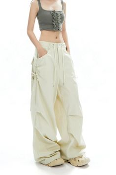 Capture the essence of casual chic with our Cargo Jogger Pants, perfect for the urban explorer. These jogger pants combine form and function with their strong cotton blend, sleek side pocket design, and comfortable drawstrings for an adjustable fit. The unique pleating at the knee not only enhances movement but adds a structured, edgy look to the silhouette. Effortlessly versatile, these joggers can be styled up with heels for a night out or paired with sneakers for a relaxed day in the city. Th Cargo Pants Design, Grunge Accessories, Cargo Jogger Pants, Urban Explorer, Sweatshirt Set, Cargo Joggers, Pants Design, Edgy Look, The Urban