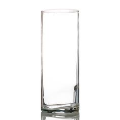 a tall glass filled with water on top of a table