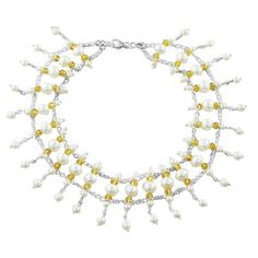 Experience the harmonious blend of natural beauty and timeless elegance with our Pearls and Crystals Symphony Necklace. Hand-crafted from freshwater pearls and crystals in various sizes, this exquisite choker-style necklace is the epitome of sophistication. The luminous natural pearls framed with golden Swarovski crystals, create a mesmerizing effect that will add a touch of glamour to any outfit, especially an off-shoulder dress or blouse. Ivory Sea Cultured Pearls Golden Swarovski Crystals Met Pearl White Crystal Pearl Chain Necklace, Pearl White Crystal Necklace With Pearl Charm, Choker Style Necklace, Crystal Choker Necklace, Meaningful Jewelry, Crystal Choker, Choker Style, Style Necklace, Necklace Sterling Silver