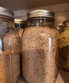 three jars filled with different types of spices