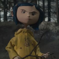 a doll with blue hair is standing next to a tree branch and looking at the camera