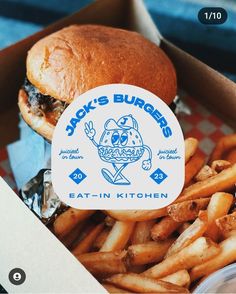 a close up of a sandwich and french fries in a box with the words jack's burgers on it