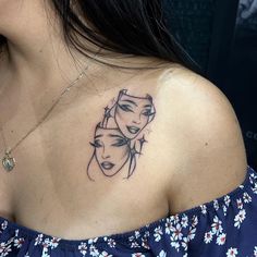 a woman with a tattoo on her shoulder