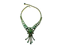 A stunning large Vintage Rhinestone Necklace - looks to be a 1970's piece in a beautiful dark green rhinestone I have absolutely no clue on the maker but I do know these pieces are getting harder to find it's in beautiful condition front and back. Green Rhinestone Necklaces For Formal Occasions, Vintage Green Crystal Jewelry, Green Crystal Necklaces With Sparkling Stones, Formal Green Rhinestone Necklaces, Green Crystal Necklace With Stones, Green Crystal Rhinestone Necklace For Formal Occasions, Glamorous Green Jewelry With Rhinestones, Glamorous Green Rhinestone Jewelry, Vintage Green Jeweled Necklaces