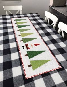 a table runner with christmas trees on it