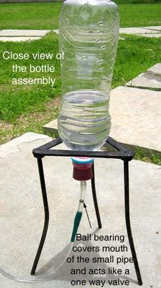 a water bottle sitting on top of a metal stand