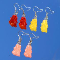 -Dangling red, yellow, and pink resin epoxy gummy bear earrings  -Gummy bears made with resin epoxy mixture with stainless steel fishhook ear wires  -Approximately 1.5 inches long -Great gift for the holidays! Resin Gummy Bear, Gummy Bear Earrings, Pretty Accessories, Bear Earrings, Gummy Bear, Yellow And Pink, Trendy Earrings, Gummy Bears, Fish Hook