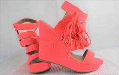 "Lovely peachy pink sandals have a 4\" wedge heels including 1\" platform. These size 6 ladies dress shoes would be perfect for summer. 5 straps 7/8\" wide go from toe to ankle. Side zipper makes them easy to get on. Outside, attached at ankle, there are double 4 1/2\" long tassels. Designed by Qupid, suede type material with cushioned insoles, these are all manmade materials. Width is approx. 3\" at widest point. Insole from heel to tip of toes is approx. 9 1/4\". Shoes show little to no wear a Pink Wedge Sandals For Spring Party, Casual Pink Wedge Sandals For Party, Summer High Heel Shoes With Tassels, Spring High Heels With Tassels, Spring High Heel Shoes With Tassels, Spring Fringe Open Toe Heels, Hot Pink Wedges, Ladies Dress Shoes, Pink Wedge Sandals