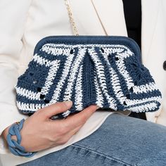 Our new Crochet Straw Clutch Bag is a unique piece, carefully handcrafted by skilled women artisans in traditional Granny Square motifs. It is an ideal choice for bohemian summer days, nights and especially summer weddings It can be used as a crossbody bag with a long strap or an elegant clutch without a strap. ✔ The main material is 100% natural straw paper yarn. It is lightweight and eco-friendly. ✔ It has a liner for easy use and an inner pocket. ✔ It comes with a removable black metal chain. Elegant Handmade Natural Clutch, Artisan Rectangular Crochet Bag, Traditional Handmade Beach Clutch, Handwoven Clutch Pouch For Gifts, Handwoven Clutch Pouch As A Gift, Elegant Handheld Woven Clutch, Elegant White Handwoven Crochet Bag, Handmade Pouch Clutch, Handwoven Pouch Clutch As Gift