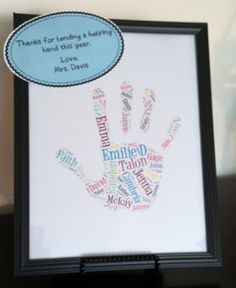 a framed hand print with the words written in different languages on it and an empty frame