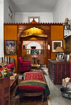 a living room filled with lots of furniture and pictures on the wall next to each other