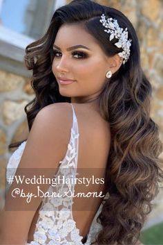 a woman with long hair wearing a wedding dress