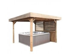 a wooden gazebo with a hot tub under it