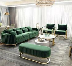 a living room filled with green couches and chairs next to a white coffee table