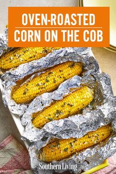 grilled corn on the cob in foil with text overlay that reads oven roasted corn on the cob