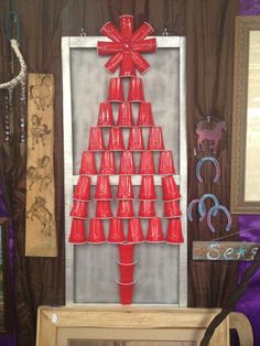 a red christmas tree made out of plastic cups