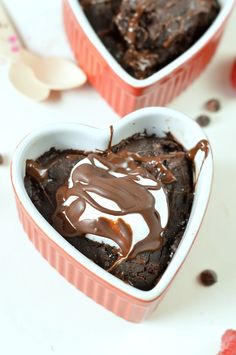 two heart shaped dishes filled with chocolate cake