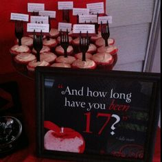 a table topped with cupcakes covered in frosting next to a sign that says and how long have you been?