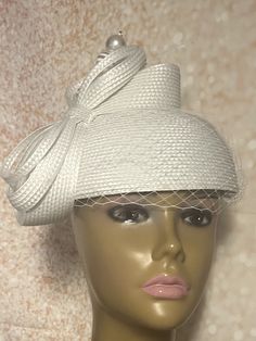 Elegant white hat for all occasions half hat fascinator: church, weddings, funeral. The hat is trimmed with bows, a hat pin and net veiling. HAT MEASUREMENTS  Diameter : 8 inches  SHIPPING  All items shipped for free will be shipped via USPS FIRST CLASS MAIL. Gifts for mom, sister, wife, or yourself. Classic White Mini Hat With Curved Brim, White Classic Mini Hat With Curved Brim, Classic White Top Hat For Kentucky Derby, Classic White Mini Hat With Short Brim, Classic White Mini Hat With Wide Brim, Classic White Wide Brim Mini Hat, White Formal Boater Hat With Short Brim, Formal White Boater Hat With Short Brim, Classic White Top Hat For Formal Occasions