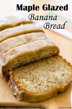 sliced loaf of banana bread sitting on top of a wooden cutting board