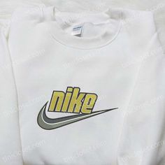 Introducing the Swoosh x Nike Embroidered Shirt, a perfect blend of style and comfort. Made with premium quality fabric, this shirt boasts the iconic Nike logo beautifully embroidered on the front, adding a touch of sophistication to your everyday look. With its regular fit and soft material, it provides a relaxed feel without compromising on style. Whether you’re going for a casual outing or a night out with friends, this shirt is designed to make you stand out from the crowd. Elevate you Nike Cartoon, Nike Inspired, Mocha Bear, Cartoon Hoodie, Maroon Hoodie, Embroidered Shirts, Mike Wazowski, Perfect Family, Corpse Bride