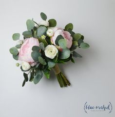 a bouquet of flowers with green leaves on a white background