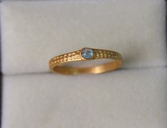 Solid Gold London Blue Topaz Round Cabochon Ring - Topaz Ring with the hammered band - Handmade Gold Ring   Stone Size  - 3 mm Round Cab      Band Width - 2 mm Thickness - 1.05 mm Gold Colour Options -  Yellow Gold, White Gold, Rose Gold  Ready to Ship 1-2 week  Customization is available, I also can make it with 9k,10k,14k,18k,22k solid gold (white or rose), and diamond accent stone, just feel free to contact me.  *    PACKAGING: The Ring will be delivered in its own jewelry box. Gift wrapping Topas Ring, Handmade Gold Ring, Gold Jewelry Gift, Bridesmaid Gifts Jewelry, Hammered Band, London Blue Topaz Ring, Cabochon Ring, Cabochons Stones, Ring Blue