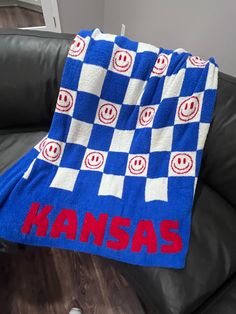 Whether you are planning to attend a football game, curl up on the couch with a good book, enjoy a movie night or add some flair to your man cave, living room or kid's room, this cozy Kansas  blanket is the perfect choice.  Each blanket is crafted using 100% polyester microfiber to ensure a cozy and indulgent experience. Available in two sizes.  Small 45"x45"/Large 50"x60" Sports Blanket, Man Cave Living Room, Football Blanket, Microfiber Blanket, Cold Weather Gear, Blanket Soft, Hair Accessories Jewelry, Football Game, Bottom Clothes