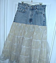 "This \"Belle Bohémienne\" jean skirt is one of my line of Renaissance Denim Couture, the name I chose for my line of couture because I take vintage denim and give it new life with French bohemian flair. To make this Renaissance Denim couture, I took an authentic pair of vintage 1970's GAP jeans and upcycled them by adding an exquisite vintage Marrika Nakk skirt that has lots of layers of gorgeous, exquisite, antique eyelet lace and soft bridal tulle in beautiful golden beige and ceam The waist Spring Lace Bottoms With Tulle Skirt, Fitted Vintage Skirt With Lace Patchwork, Bohemian Tiered Skirt Bottoms With Lace Patchwork, Fitted Denim Bohemian Skirt, Fitted Bohemian Denim Skirt, Bohemian Fitted Skirt With Lace Patchwork, Vintage Tulle Skirt For Spring, Bohemian Skirt With Lace Patchwork, Vintage Skirt For Spring Festival