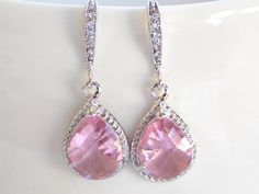 Stunning silver earrings featuring a beautiful  Pink color! These beautiful glass faceted beads are suspended from sparkly cubic zirconia ear wire. Absolutely gorgeous and elegant!***Pear shaped: 12x18mm (including loop)***Earrings measure approximately 32mm including the ear wire.***Polished Rhodium Frame*Each pair of earrings will be individually wrapped, ready for gift giving!IF YOU HAVE ANY QUESTIONS, PLEASE CONVO ME.Visit my shop at http://www.etsy.com/shop/florbridaljewelry******All jewelr Ligth Pink, Angel Wing Earrings, Orange Earrings, Loop Earrings, Jewelry Bridesmaid, Wedding Jewelry Earrings, Wing Earrings, Pink Earrings, Bridesmaid Earrings