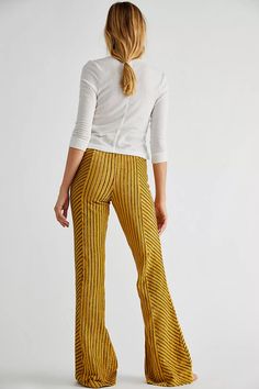 Slim Pull-On Velvet Flare Pants | Free People Chic Vertical Stripes Pants For Fall, Striped Wide-leg Pants For Fall, Chic Stretch Bottoms With Vertical Stripes, Fall Striped High-waisted Pants, Stretch Wide Leg Bottoms With Vertical Stripes, Striped Wide Leg Bottoms For Fall, Wide Leg Striped Bottoms For Fall, Striped Trousers For Fall, Striped High-waisted Pants For Fall