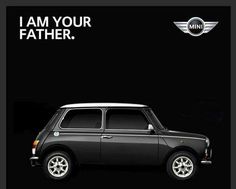 a black mini car with the words i am your father