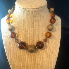 "This listing is for a beautiful necklace.  It is made with golden brown translucent and brushed gold beads in a single strand. Size:  Approximately 16\" in length Condition:  Good condition for being vintage Want to purchase 3 or more items from my shop?  Please use the following coupon when you check out to receive 20% off! https://www.etsy.com/shop/elsysvintage?coupon=ELSYSDISCOUNT *Please be aware the items I am selling are vintage, which means they are old and with anything old there will b Cheap Brown Costume Jewelry Necklaces, Cheap Brown Beaded Costume Jewelry Necklace, 1960s Costume, Gold Beaded Necklace, Minimalist Necklace Gold, Necklace Everyday, Daisy Necklace, Gold Bead Necklace, Necklace Minimalist