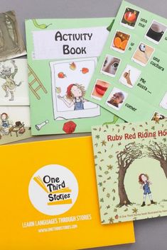 there are many different books on the table with each child's picture in them