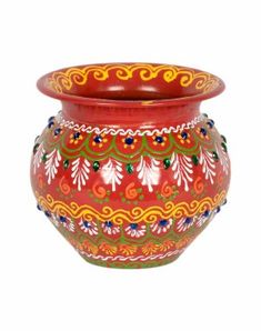 a red vase with colorful designs on it