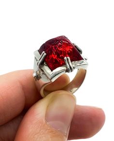 "Vintage Artisan Brutalist Sterling Silver Red Glass Sugarloaf Ring Size 6.75 Up for offer is a unique and stunning vintage artisan made brutalist solid sterling silver and rub red art glass carved sugar loaf paste rhinestone ring. Ring is marked \"925\". Measurements Ring Size: 6.75 Sugarloaf: 13mm x 13mm x 10m Band Width: 5mm Weight: 10.3 g Condition: Excellent; item is pre-owned and may have some signs of light use. Please inspect pictures for overall condition. This item comes from a clean, Sugarloaf Ring, Sterling Ruby, Antique Style Rings, Mens Gemstone Rings, Artisan Rings, Sterling Silver Bangle Bracelets, Cabochon Ring, Rhinestone Ring, Red Art