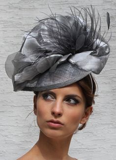 Gorgeous Silver Kentucky derby hat, grey derby fascinator and statement Royal Ascot fascinator. Astonishing Sunday church silver grey hat, Wedding guest Haute Couture Hat, Tea party fascinator and Melbourne cup headpiece This gorgeous evening silver grey hat made on a grey headband from light grey sinamay base, silver grey satin petals and ostrich feathers and finished on the back with silver grey satin silk. This headpiece is MADE TO ORDER! We need 5 working days to make it. ♠  MATERIALS: Base: Simamey Silk Feathers ♠  COLORS:  This headpiece is available in silver gray ♠  SIZES: It fit ALL head sizes.  ♠  DELIVERY - The delivery will be made by FedEx/TNT express service at the Post rate. The package must be signed for on receipt, therefore cannot be sent to PO Box or Mail Receiving Cente Elegant Silver Hat For Evening, Elegant Silver Hat For Kentucky Derby, Elegant High Crown Fascinator For Spring, Elegant Silver Costume Hats And Headpieces For Formal Occasions, Elegant Silver Fascinator, Elegant Fitted Silver Fascinator, Chic High Crown Mini Hat For Races, Elegant Gray Hat With Short Brim, Gray Brimmed Hat For Kentucky Derby