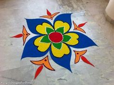 a colorful flower design on the ground