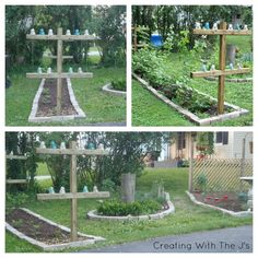 the garden is full of plants and flowers, including an assortment of vases on wooden posts