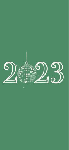 a green background with white numbers and a disco ball in the shape of a christmas ornament